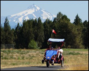 Riding bicycles with mountain in background