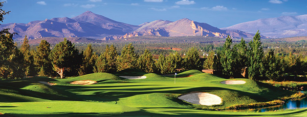 Golf course with mountain background